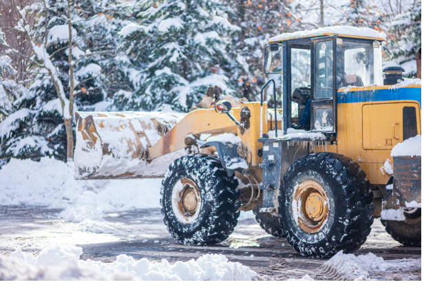 One Solution plow truck clearing snow from a commercial drive